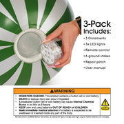 3 Pack includes: 3 ornaments, 3x LED Lights, Remote control, 6 ground stakes, repair patch, user manual. Warning! WARNING! Ingestion Hazard: This product contains a button cell or coin battery. Death or serious injury can occur if ingested. A swallowed button cell or coin battery can cause internal chemical burns in a s little as 2 hours. Keep new & used batteries out of reach of children. Seek immediate medical attention if a battery is suspected to be swallowed or inserted inside any part of the body.